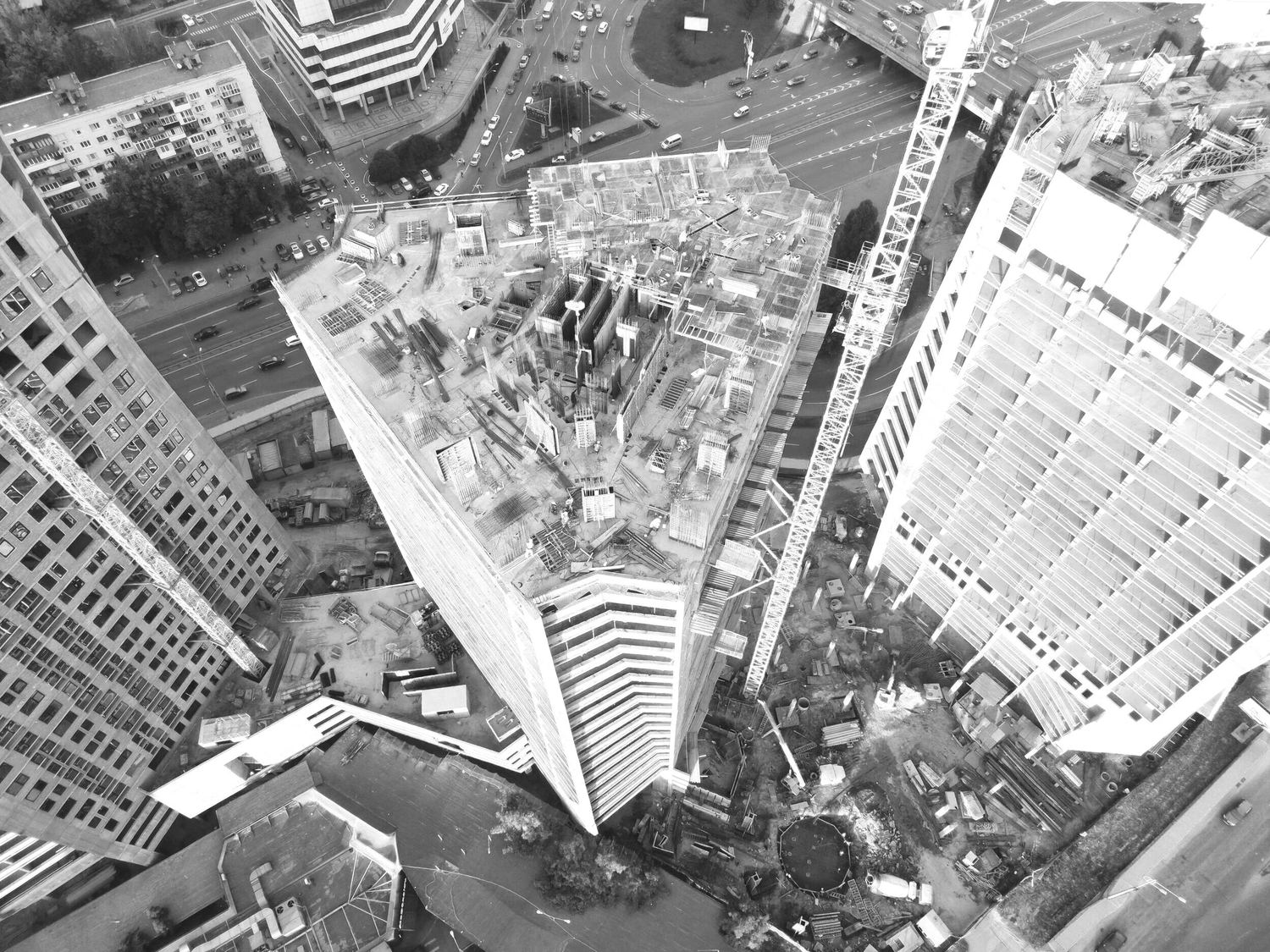 A high-rise tower under construction, seen from above